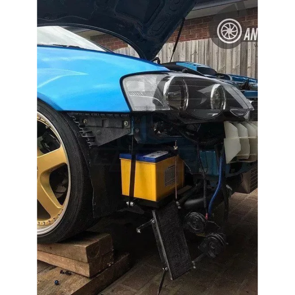 ANTZ-BAUHRELO $319.9 ANTZ Battery Relocation Under Headlight / Behind Bumper Kit Suit Ford Falcon BA BF XR6 $319.9 Relocate your existing battery behind the factory fog lights area on driver side, this allows the cables to be kept as short as possible to prevent any voltage drop or poor starting. Installation is very simple, no cutting of cables is needed.--This is used to allow larger turbo side air intakes Relocate your existing battery behind the factory fog lights area on driver side, this allows the c